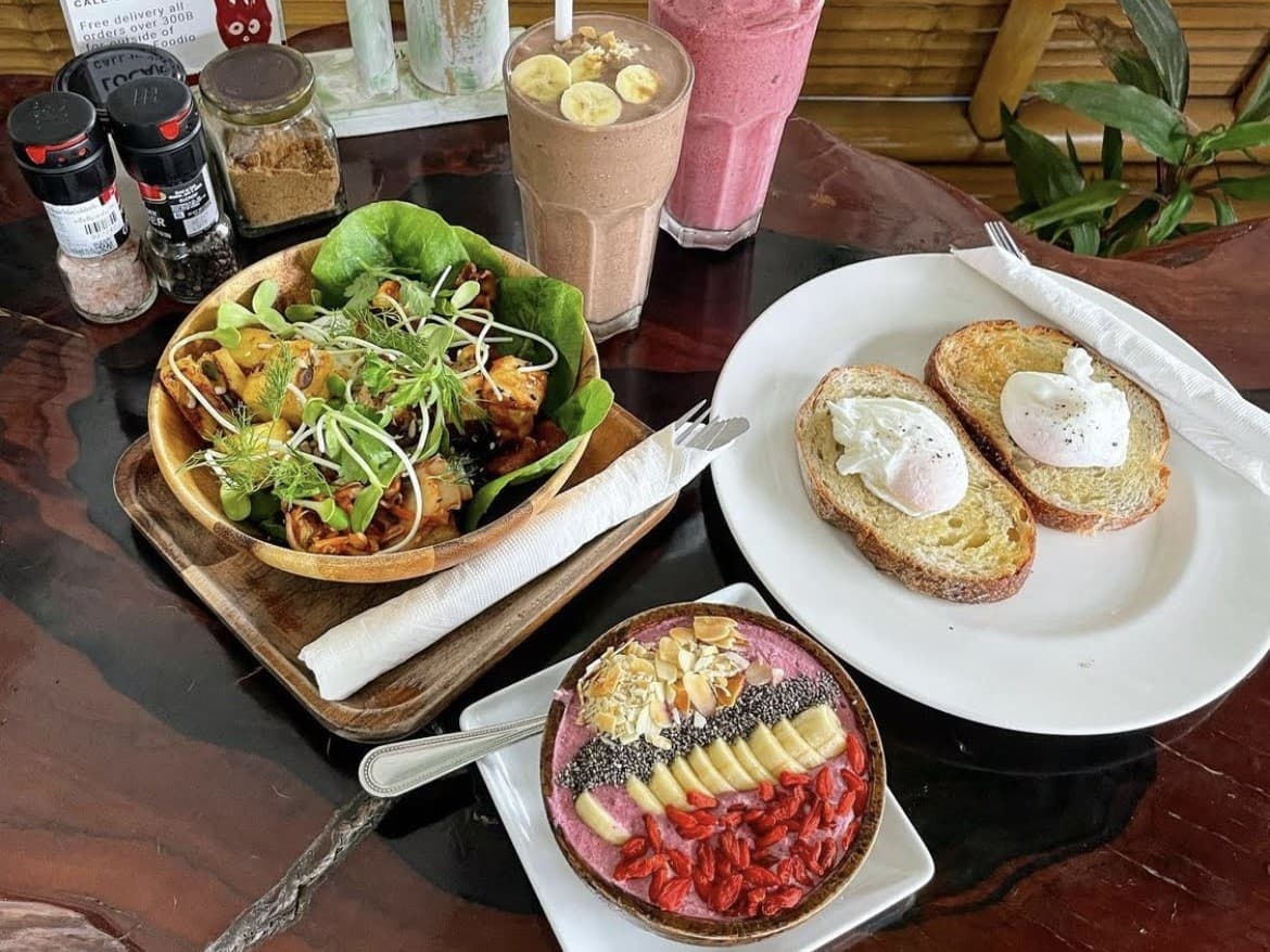 Wilsons brunch spread — poached eggs on sourdough, chia bowl, smoothies