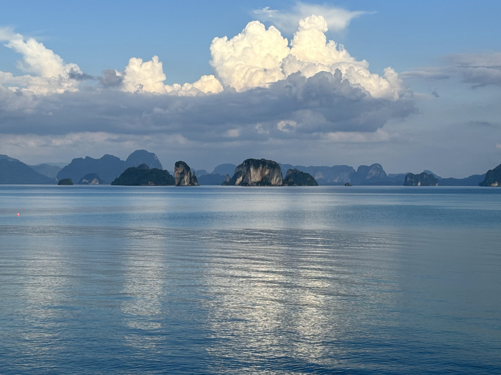 Peaceful view of limestone islands in Phang Nga Bay as seen from Koh Yao Noi, a quiet island hopping destination from Phuket.