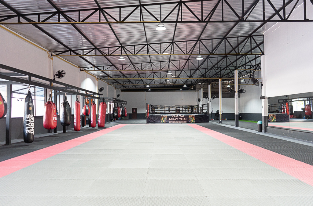 Interior of Yak Yai Muay Thai gym in Phuket with heavy bags and boxing ring