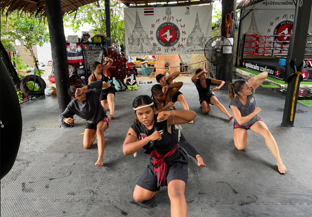 Women training traditional Muay Thai techniques at Kru Bird Muay Thai gym in Phuket
