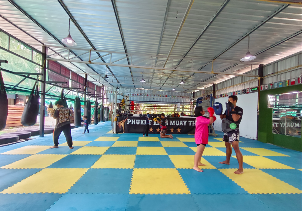 Kids training Muay Thai at Phuket King Muay Thai gym in Phuket with heavy bags and boxing ring
